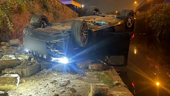 Drunk-driver narrowly avoids driving into canal after crashing car inches from water