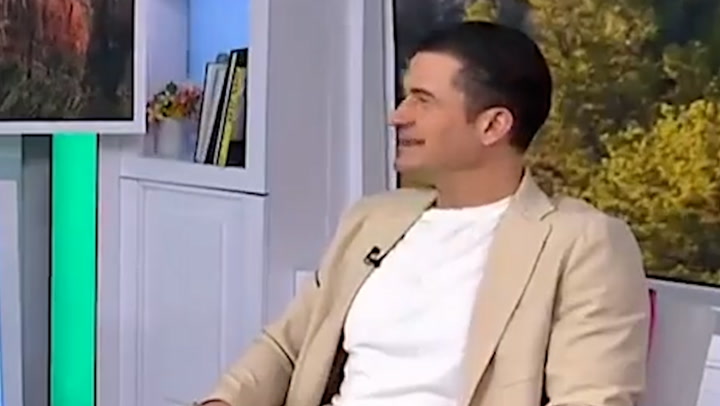 Orlando Bloom lets slip Katy Perry is working on new music during live interview