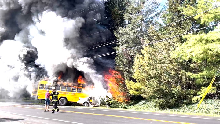 Thick plumes of smoke fill air after fiery school bus crash kills one