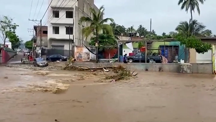 Streets and shops flooded after hurricane Roslyn rips through Mexico’s Pacific coast