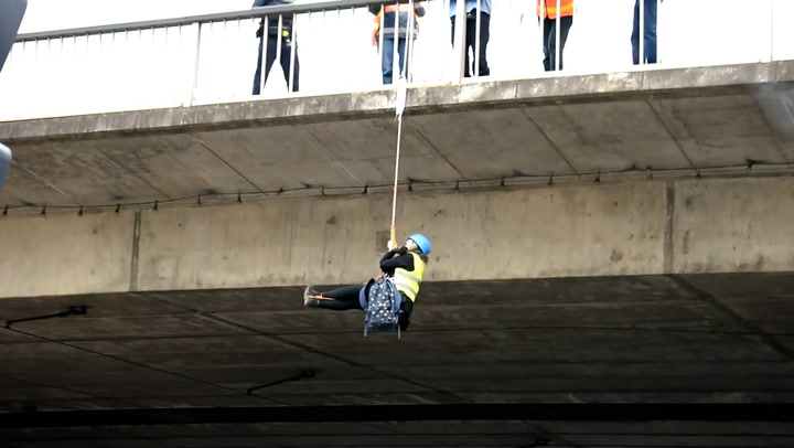 Climate activist hangs from Adelaide bridge during Extinction Rebellion protest
