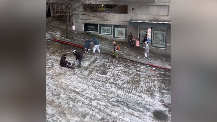 Icy Seattle hill proves comically impossible for pedestrians to walk up