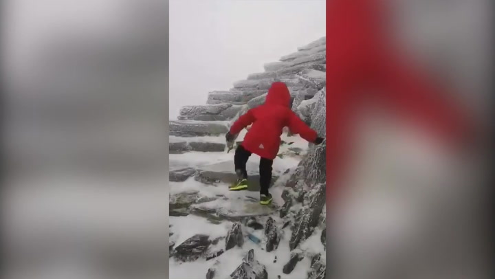 Four-year-old amputee hikes through Storm Arwen to become youngest to scale Snowdon