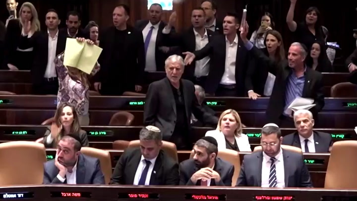Security staff eject Knesset members chanting 'shame' after Israeli judicial changes