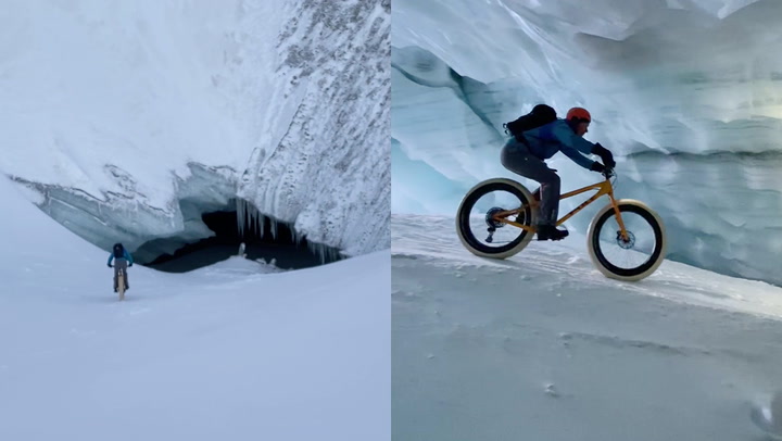 Cyclist rides through breathtaking glacier cave in Switzerland