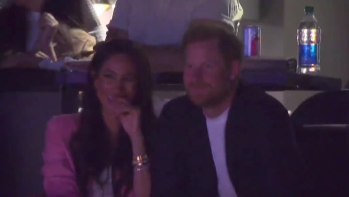 Harry and Meghan spotted laughing together at Lakers game