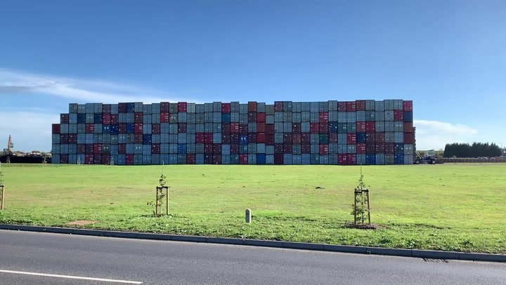 Mountain of freight containers stored in field amid port supply problems