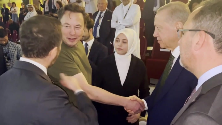 Elon Musk shakes hands with Turkish president Erdogan at World Cup final