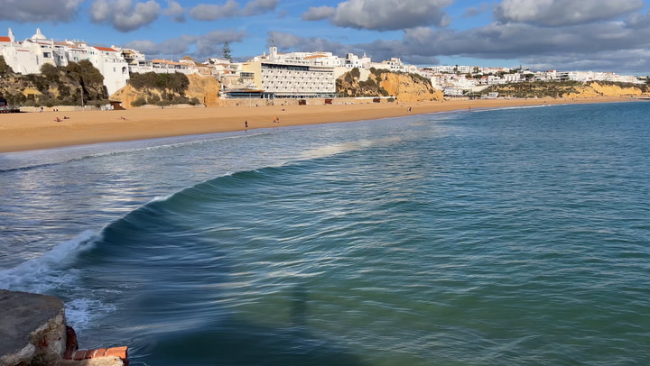 Wave approaches Portuguese beach, Albufeira 