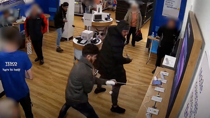 CCTV captures thieves fleeing Tesco with £10,000 worth of phones in front of stunned staff