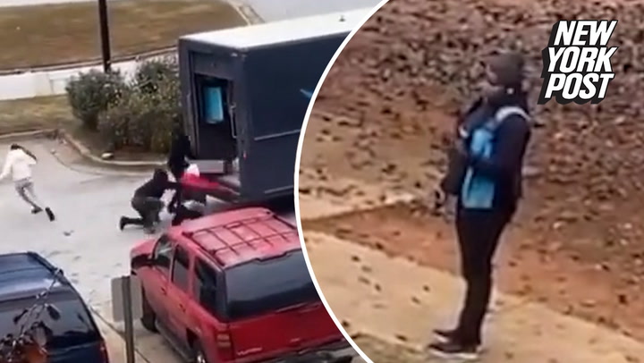 Helpless Amazon driver watches as group of looters raid her truck