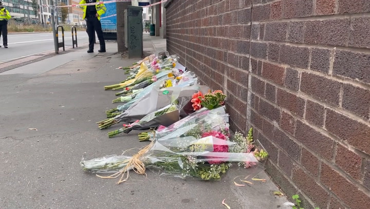 Flowers left at the scene where 15-year-old girl was fatally stabbed