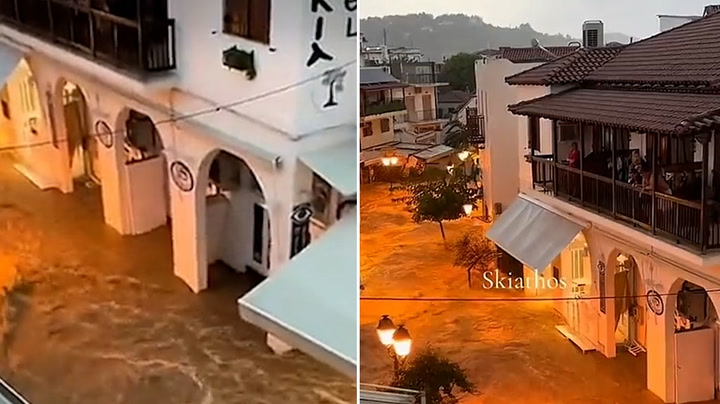 Flood water gushes down Skiathos road as intense rain hits Greece