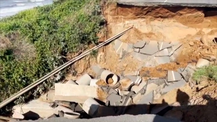 Road washed out after damaging floods in South Africa