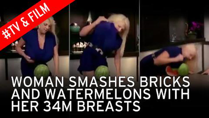 Woman uses breasts to crush watermelons on Make a GIF