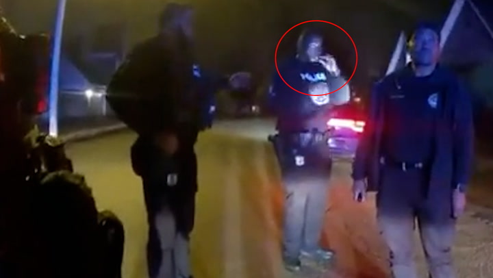 Memphis police officers laugh and one smokes cigarette after Tyre Nichols beating