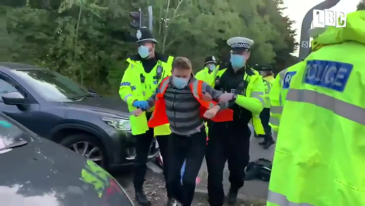 Climate protesters blockading M25 dragged away by police