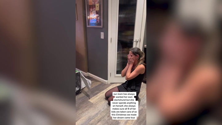 Mother who 'never buys anything for herself' breaks down as family gift her puppy