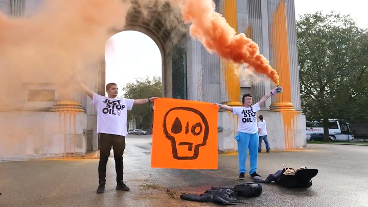 Just Stop Oil protesters paint Wellington Arch orange