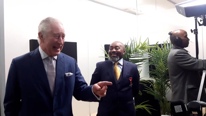 King Charles laughs and smiles during visit to new Africa Centre