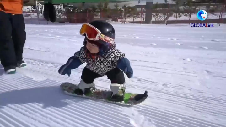 Snowboarding baby goes viral after hitting slopes at just 11 months