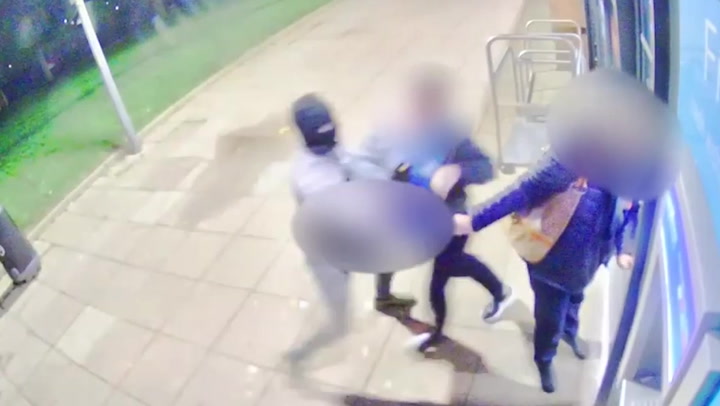 Terrifying moment Co-op staff were robbed at knifepoint by armed thieves