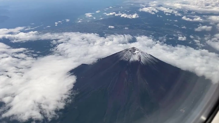 Mount Fuji's first snowcap of the season comes almost a month early