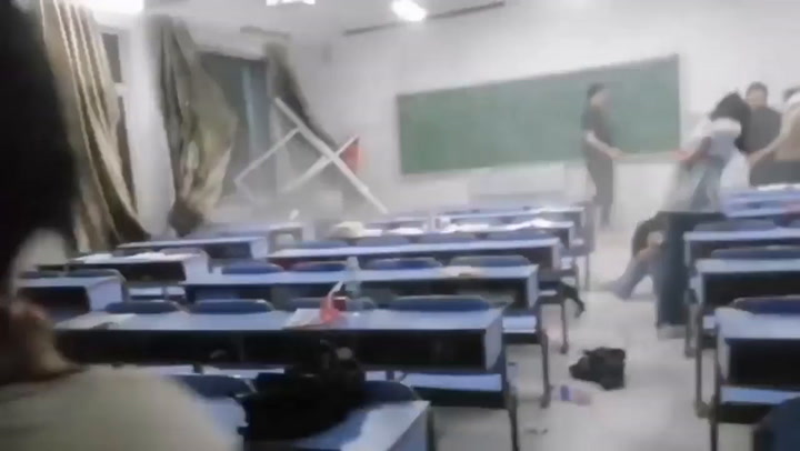 Storm blows out windows of China classroom while students inside