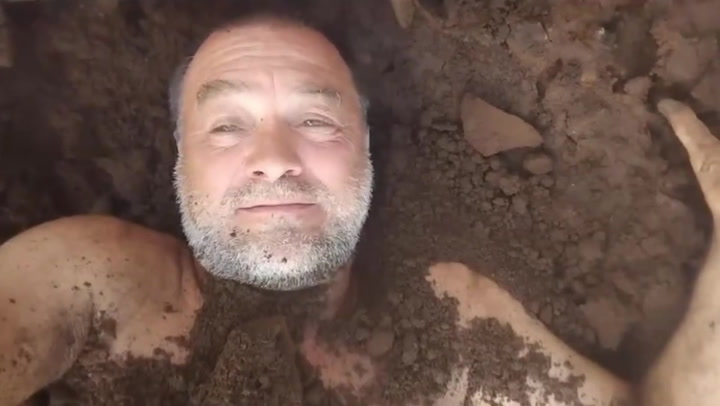 Former Argentine MP buries himself in dirt to protest President Milei legislation