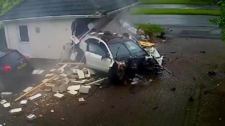 Mercedes smashes into garage while family at home in Derby in shocking footage