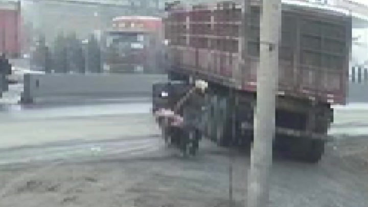 Good Samaritan saves elderly woman from being run over by reversing truck