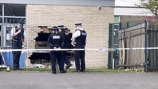 Emergency services at scene after car crashes into Liverpool school