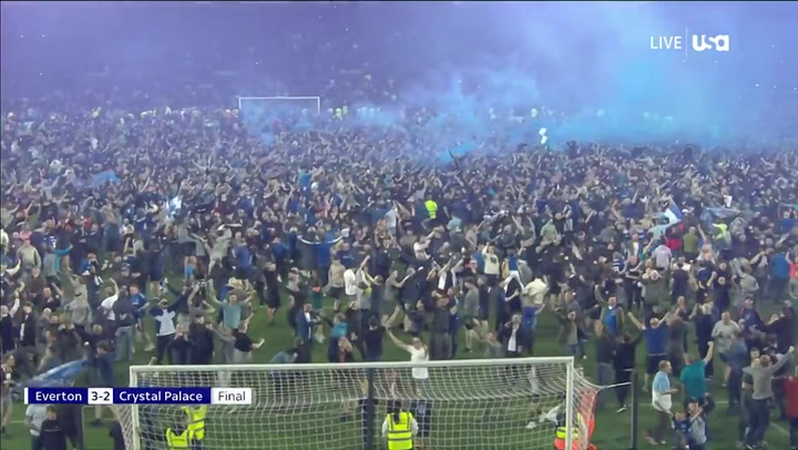 Fans invade pitch as Everton secure Premier League survival