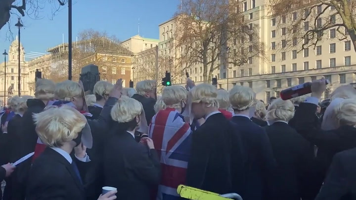Bizarre Boris 'protest' outside Parliament sees crowd dressed as PM