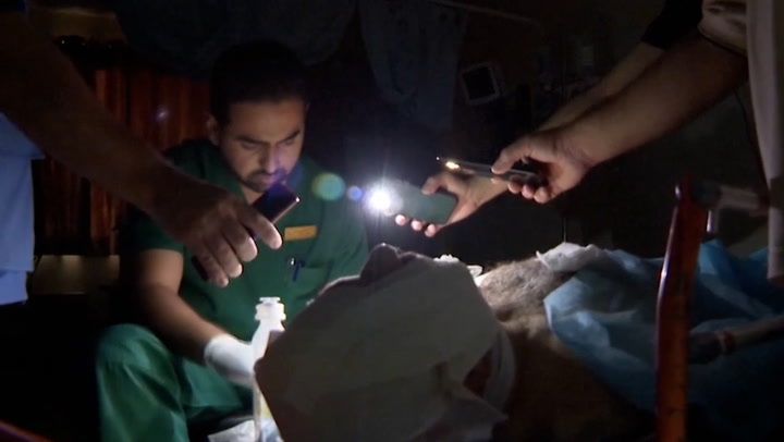 Doctors operate by torchlight in Gaza as hospital unable to power generators