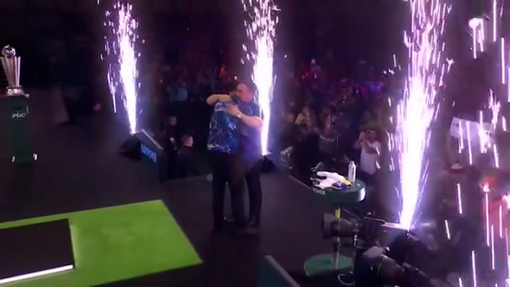 Luke Humphries embraces teenage Luke Littler after World Darts Championship final