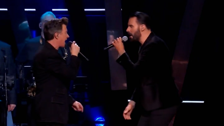 Rick Astley and Rylan Clark perform classic 80s hit to bring in New Year
