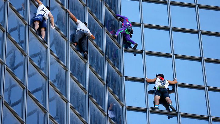 'French Spider-Man' climbs Paris tower to protest COVID health pass