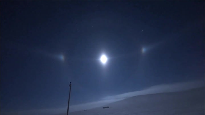 Driver captures ultra-rare 'moon halo' in frozen wilderness