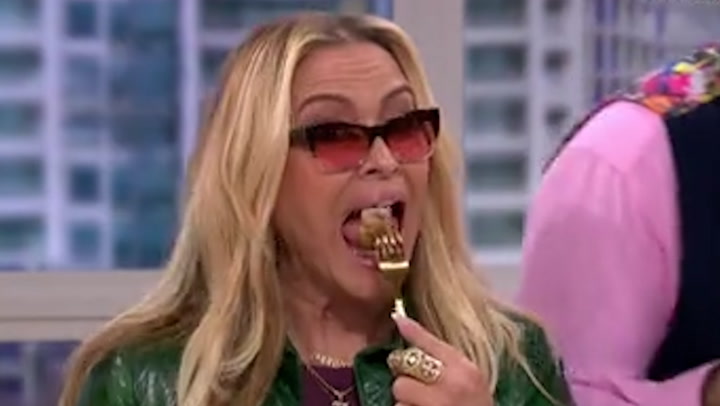 Vegetarian singer Anastasia eats Ainsley Harriott's pork dish on live TV