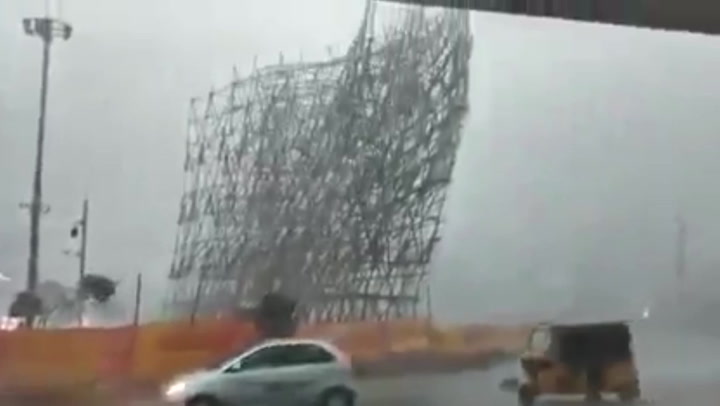 Dramatic moment 70-foot scaffolding tower collapses during heavy rain