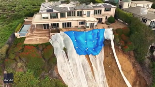 Multimillion-dollar homes sit on cliff edge after landslide