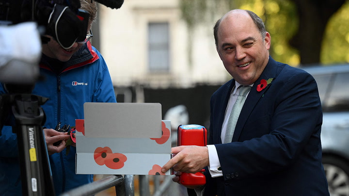 Defence secretary Ben Wallace sells poppies to journalists outside Downing Street