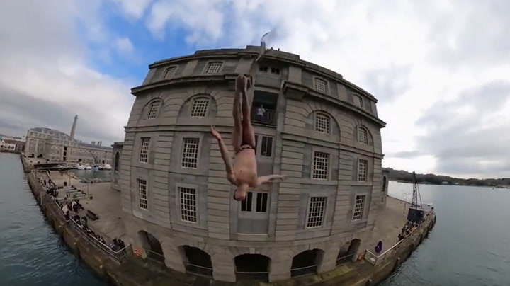 Red Bull cliff diver jumps from Plymouth penthouse apartment in daring stunt