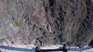 Driver airlifted to safety after surviving 400ft plunge over cliff