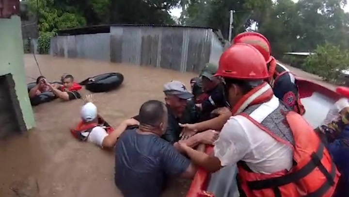 Man in inflatable ring rescued from flood as Hurricane Julia hits Central America