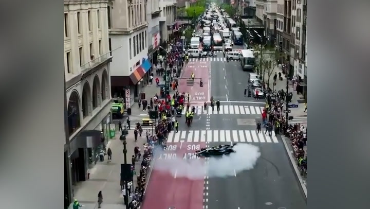 Lewis Hamilton shuts down New York's Fifth Avenue performing doughnuts in F1 car