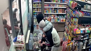 Watch: Armed robbers trapped inside shop by hero shopkeeper