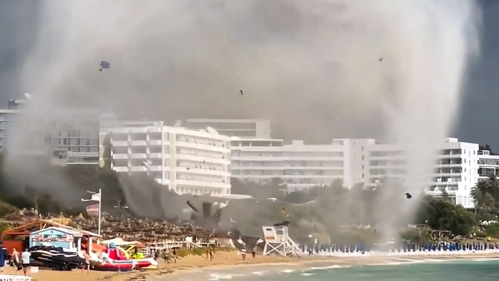 Waterspout sends tourists running for cover as it tears Ayia Napa beach apart