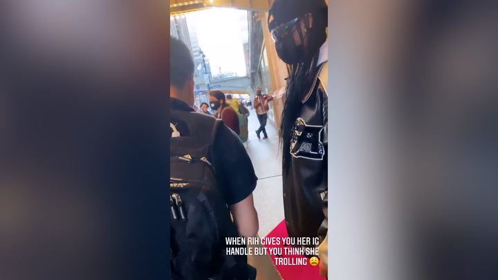 Protester doesn't recognise Rihanna as she gives him her Instagram handle